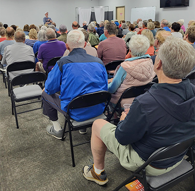 crowd listening to Krueger at the Beagle event