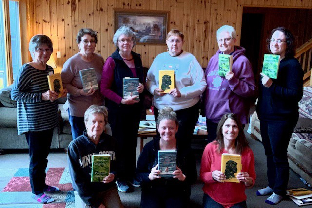 Retreat participants with their books