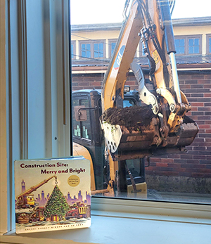 Construction in process with book in foreground